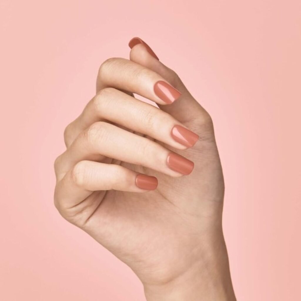 Terracotta nude press-on nails with a smooth glossy finish, perfect for a trendy everyday look.